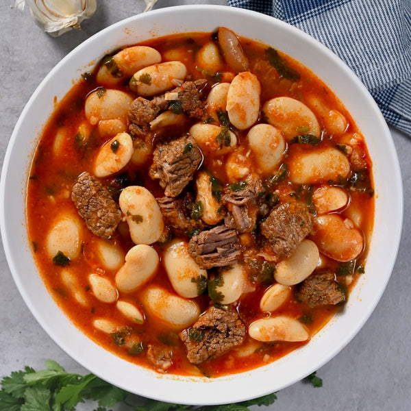 A hearty Lebanese white bean and beef stew with tomato broth, herbs, and tender chunks of meat.